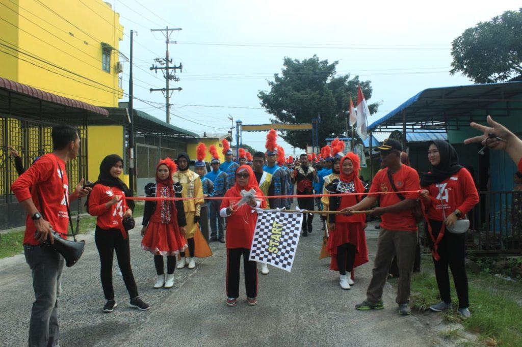 Jalan Sehat Kuala Tanjung, IPKTB dan Pemdes Tampil dengan Jiwa Patriotis