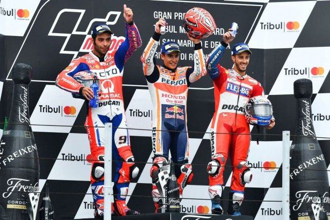 Podium juara MotoGP San Marino ditempati oleh Marc Marquez, Danilo Petrucci dan Andrea Dovizioso. (AFP PHOTO / ANDREAS SOLARO)