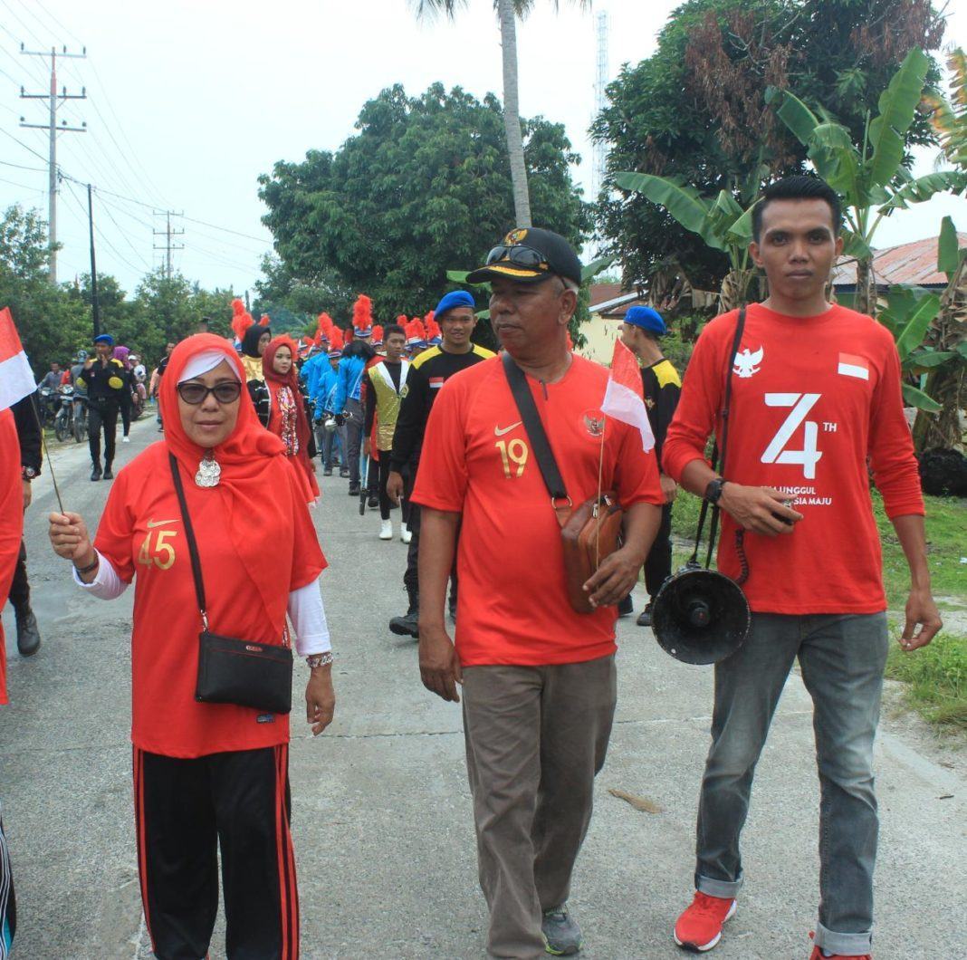Jalan Sehat Kuala Tanjung, IPKTB dan Pemdes Tampil dengan Jiwa Patriotis