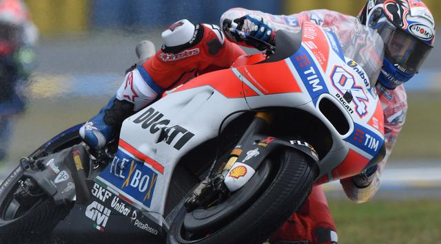 Pembalap Ducati Andrea Dovizioso memenangi balapan MotoGP Italia di Sirkuit Mugello, Minggu (4/6) malam WIB. (JEAN-FRANCOIS MONIER / AFP)